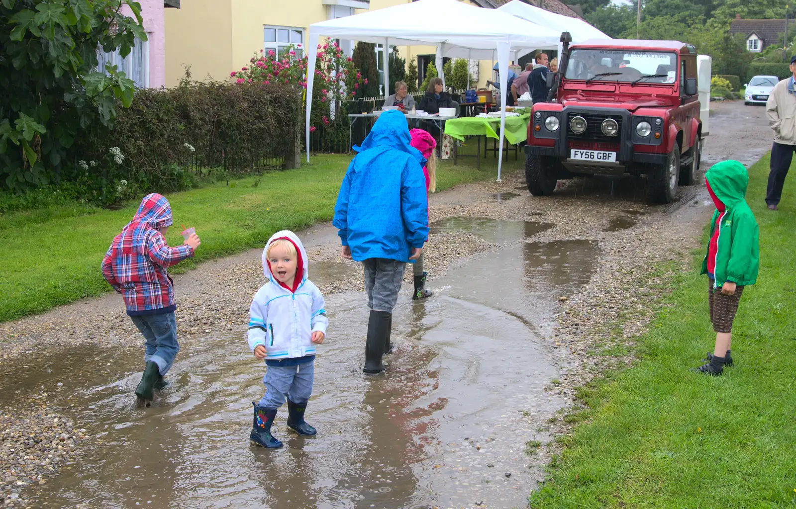 The boys splash around in a puddle, from Thrandeston Pig, Little Green, Thrandeston, Suffolk - 29th June 2014