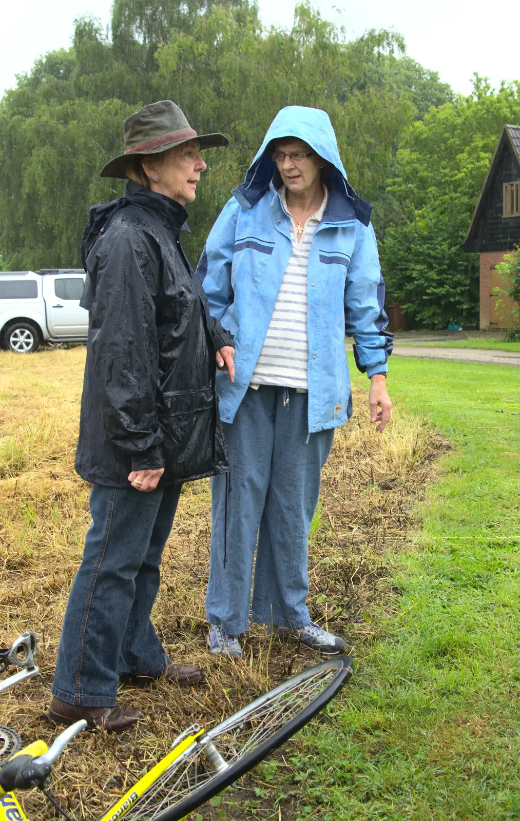 Janice chats to someone in the rain, from Thrandeston Pig, Little Green, Thrandeston, Suffolk - 29th June 2014