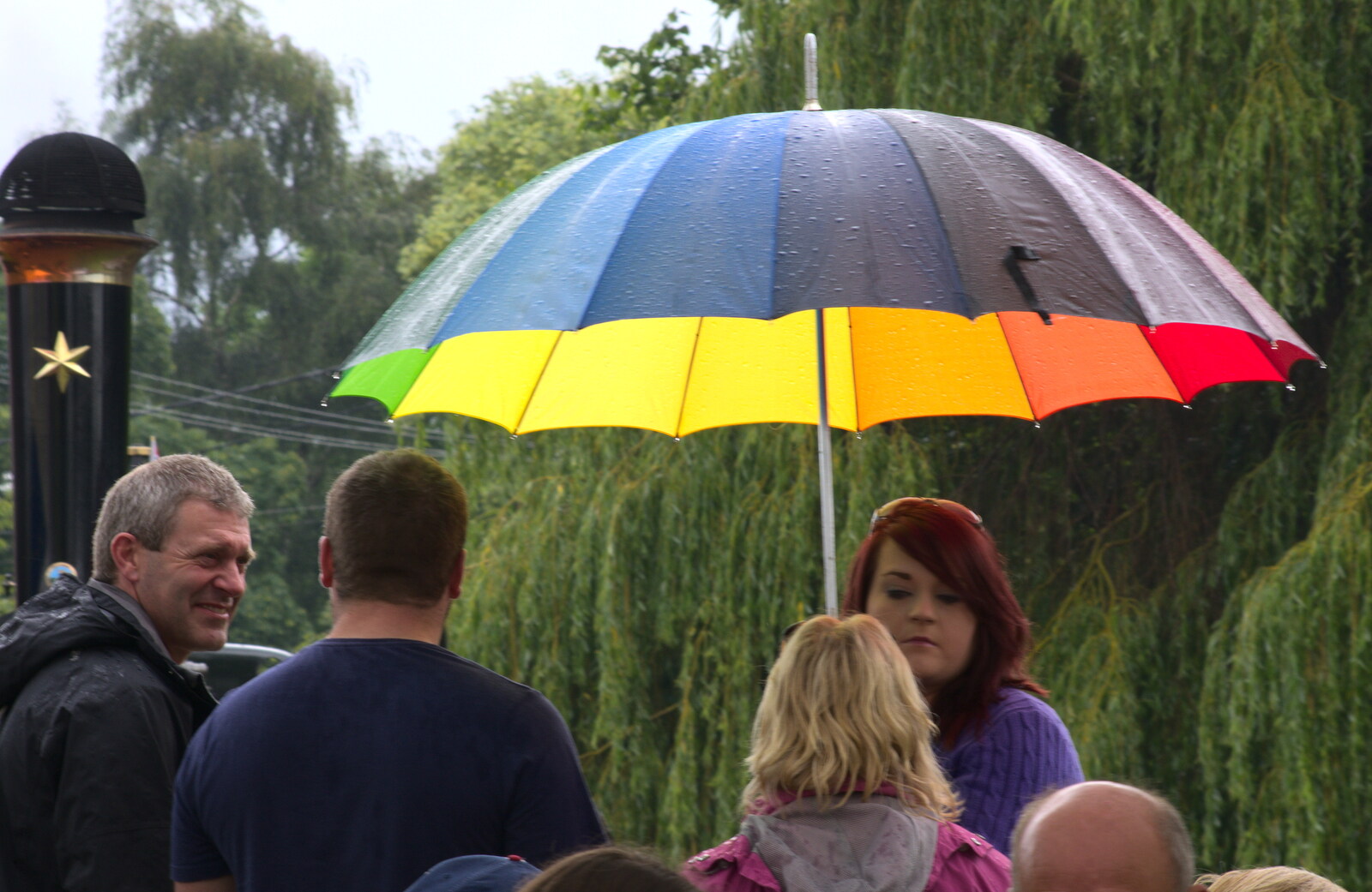 Rainbow umbrella from Thrandeston Pig, Little Green, Thrandeston, Suffolk - 29th June 2014