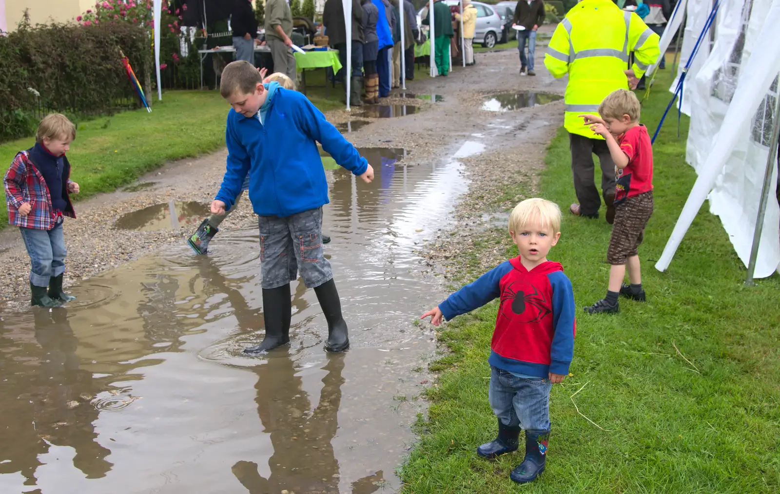 Harry points at the puddle, from Thrandeston Pig, Little Green, Thrandeston, Suffolk - 29th June 2014