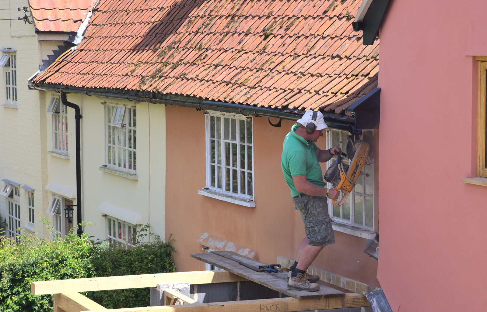 Andrew cuts out the old window from The Village Summer Fête, Brome, Suffolk - 5th July 2014