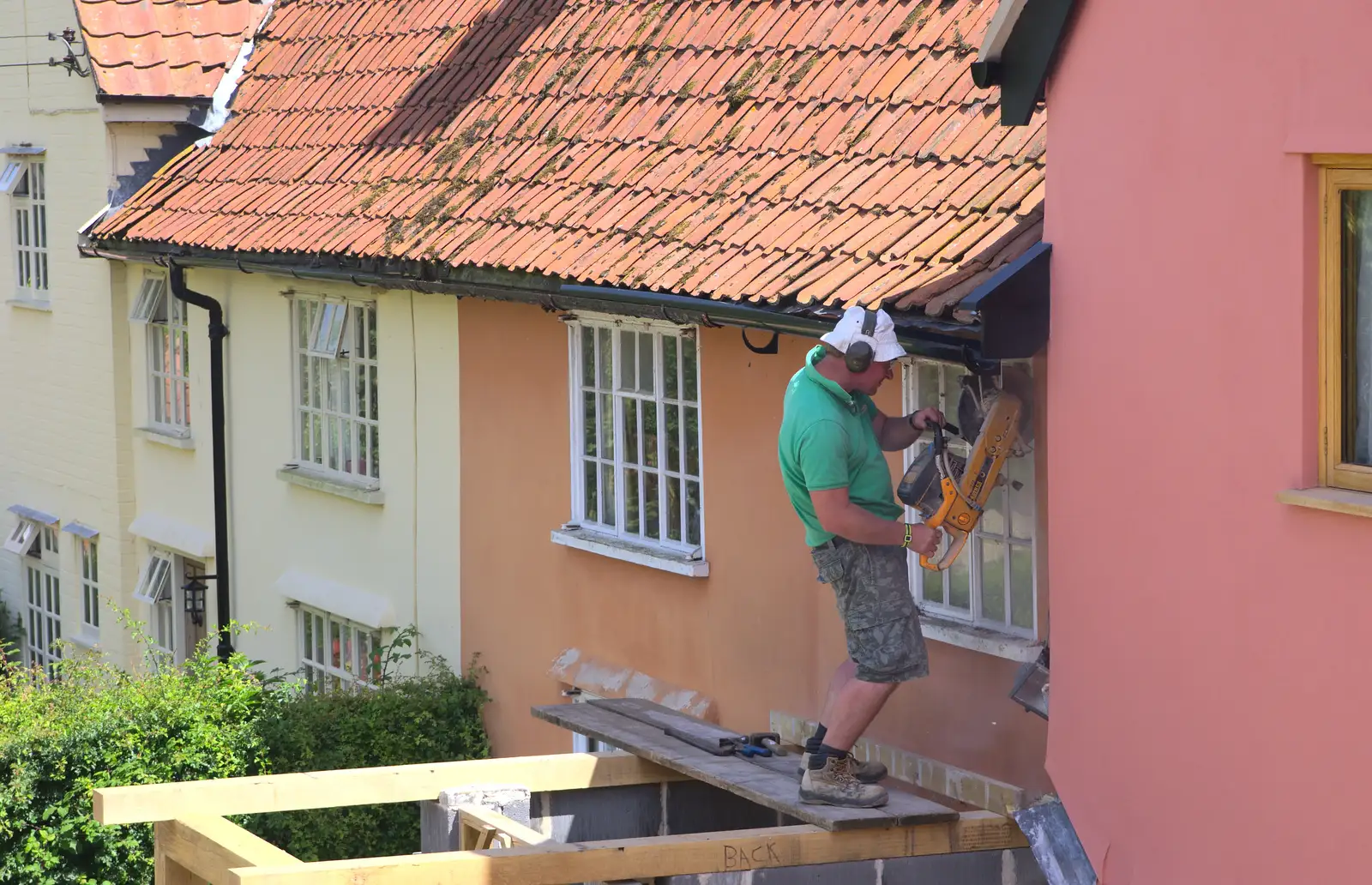 Andrew cuts out the old window, from The Village Summer Fête, Brome, Suffolk - 5th July 2014