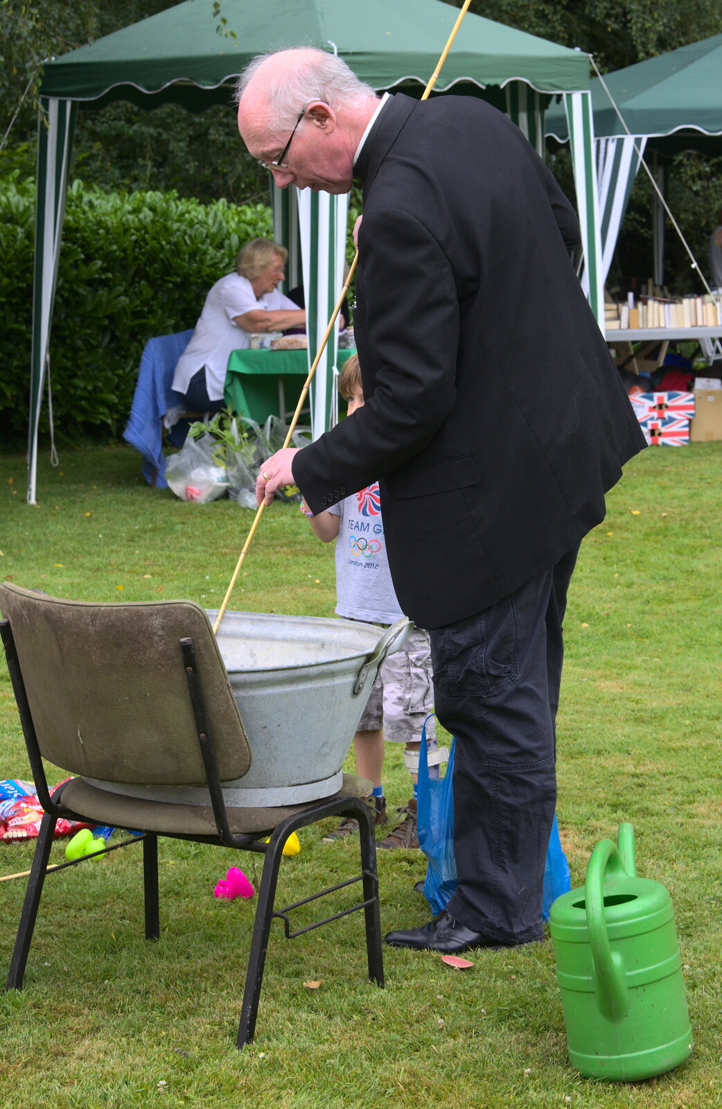 The Rev pokes a tin bath with a stick from The Village Summer Fête, Brome, Suffolk - 5th July 2014