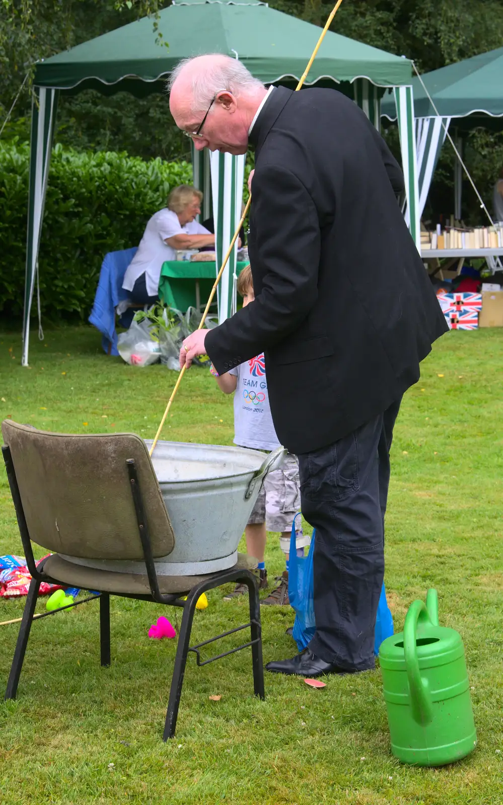 The Rev pokes a tin bath with a stick, from The Village Summer Fête, Brome, Suffolk - 5th July 2014