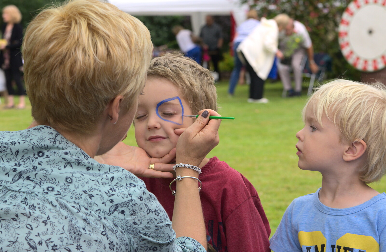 Fred gets face painting as Harry looks on from The Village Summer Fête, Brome, Suffolk - 5th July 2014