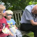 The boys eat sausage with Grandad, The Village Summer Fête, Brome, Suffolk - 5th July 2014