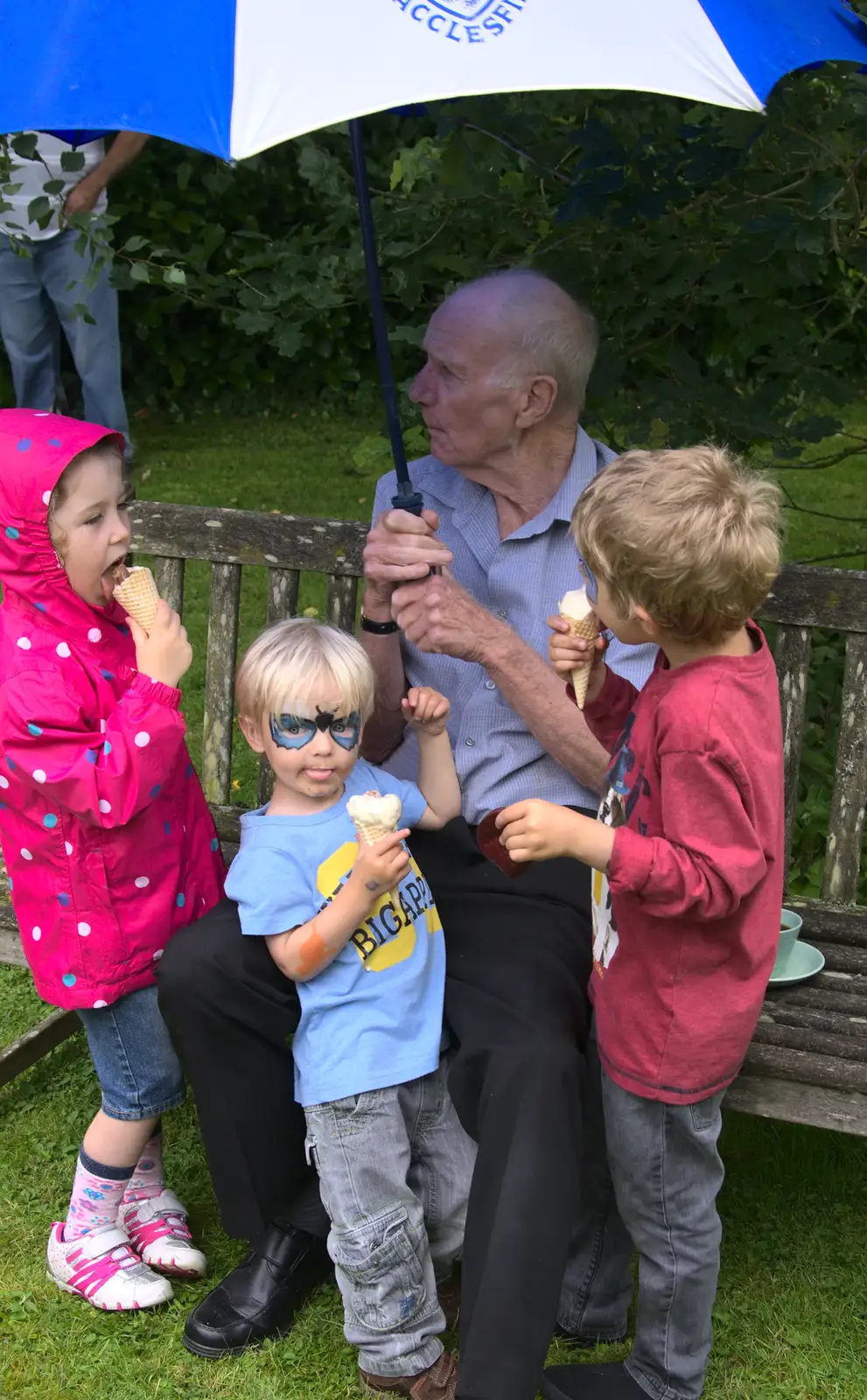 Everyone shelters under an umbrella, from The Village Summer Fête, Brome, Suffolk - 5th July 2014