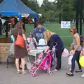 Alex lifts a massive cake, St. Peter and St. Paul's School Summer Fete, Eye, Suffolk - 12th July 2014