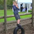 Fred swings about on a tyre, St. Peter and St. Paul's School Summer Fete, Eye, Suffolk - 12th July 2014