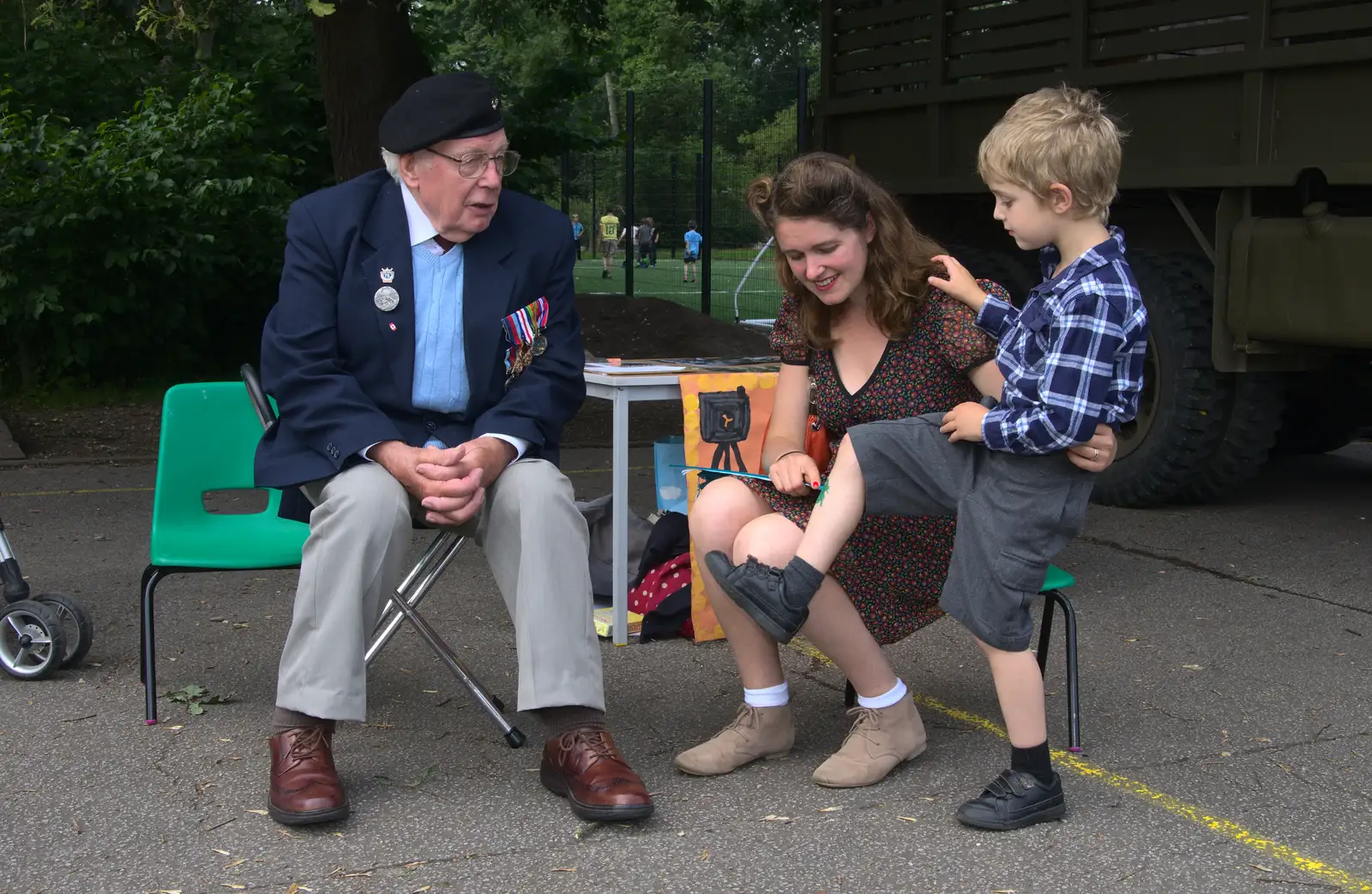 Fred shows off his shin tatoo to Alan King, from St. Peter and St. Paul's School Summer Fete, Eye, Suffolk - 12th July 2014