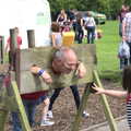 Mr Beckley the caretaker is in the stocks, St. Peter and St. Paul's School Summer Fete, Eye, Suffolk - 12th July 2014