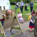 Mr Beckley the caretaker is in the stocks, St. Peter and St. Paul's School Summer Fete, Eye, Suffolk - 12th July 2014