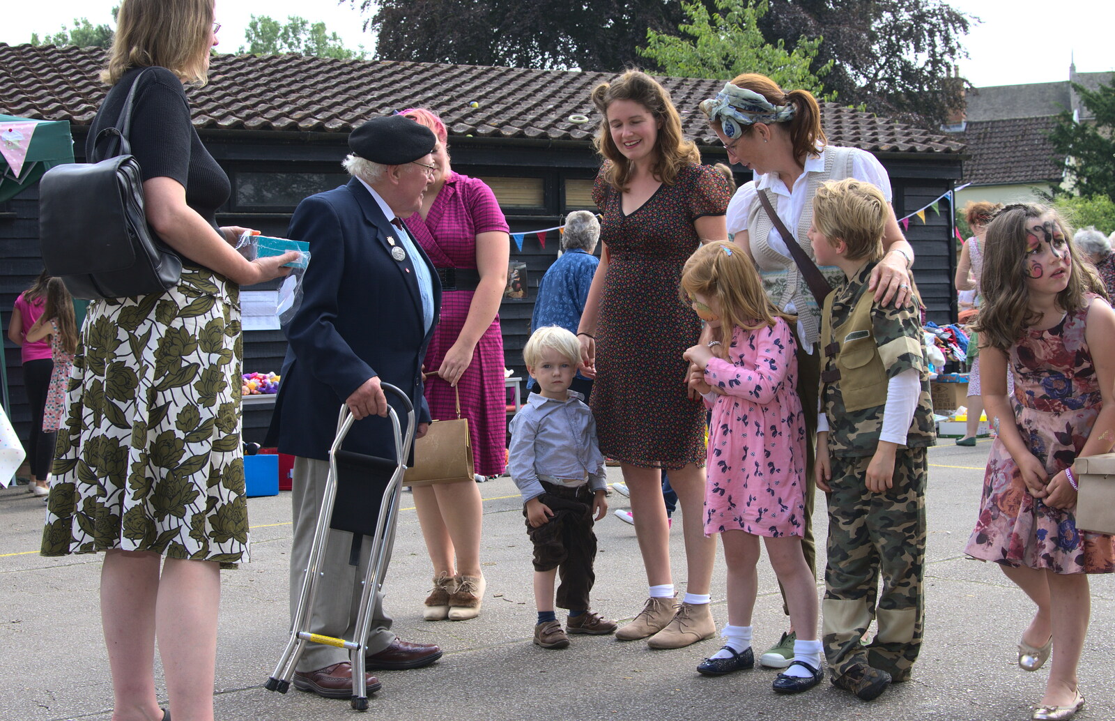 Harry rolls his trouser leg up from St. Peter and St. Paul's School Summer Fete, Eye, Suffolk - 12th July 2014
