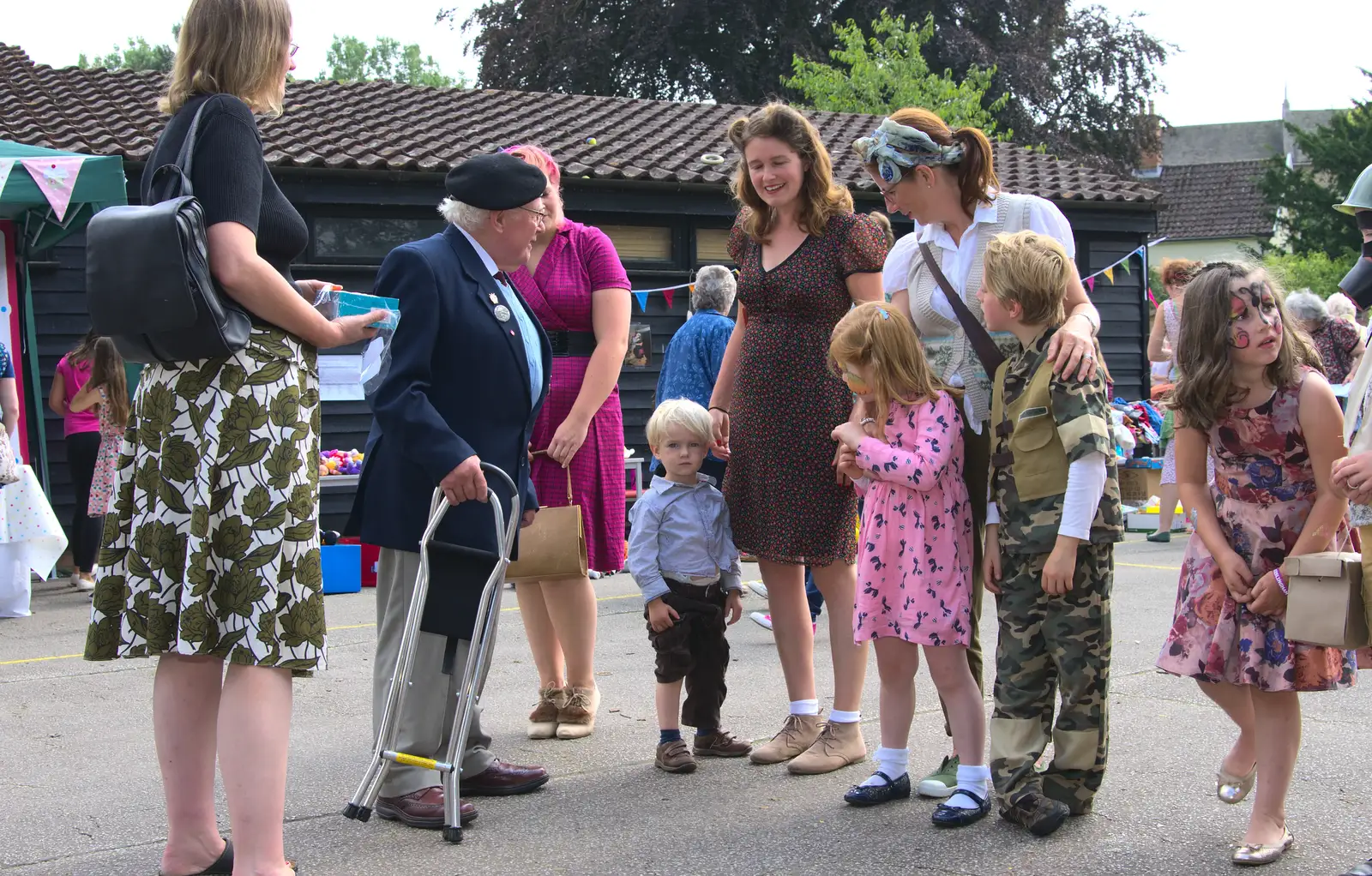 Harry rolls his trouser leg up as Alan King judges, from St. Peter and St. Paul's School Summer Fete, Eye, Suffolk - 12th July 2014