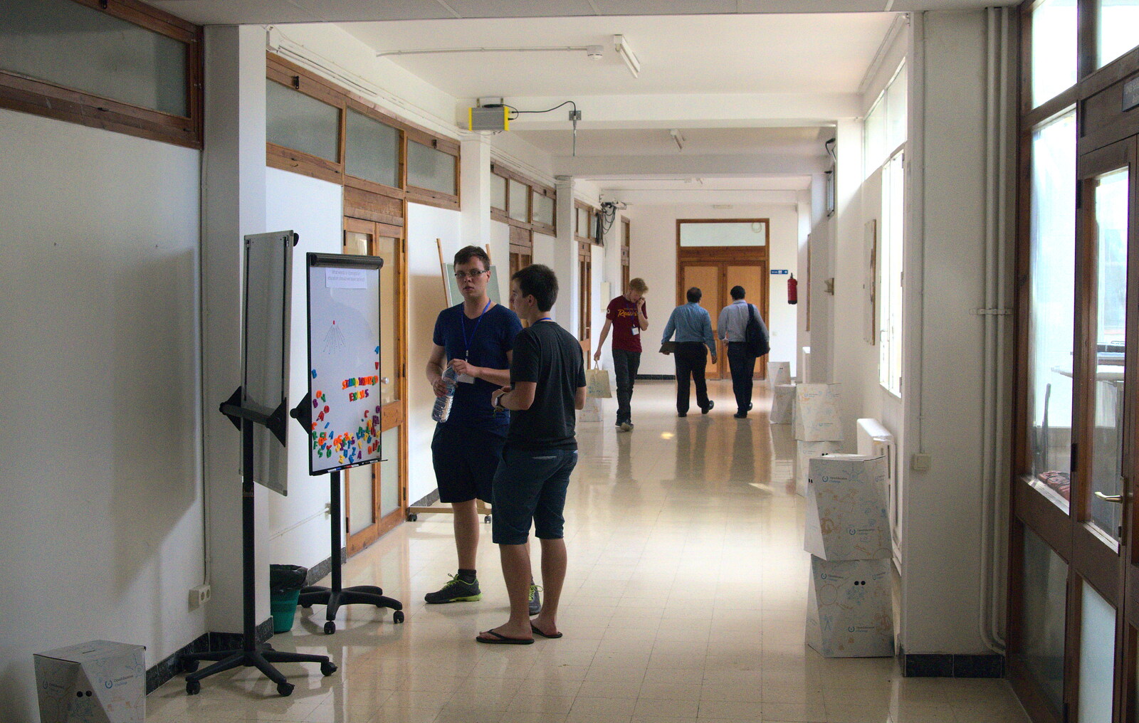 People mill around the corridors from The Open Education Challenge, Barcelona, Catalonia - 13th July 2014