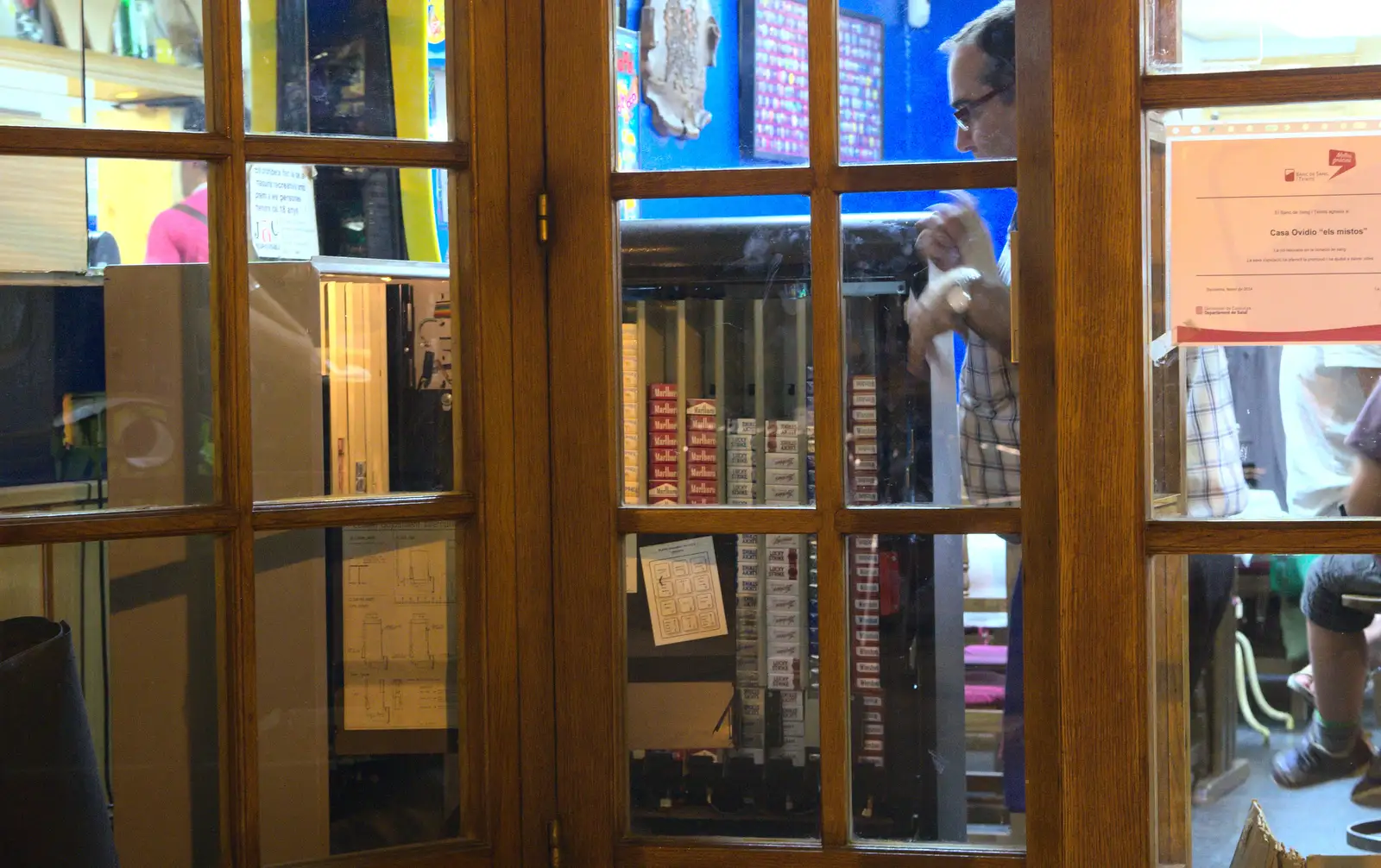 An actual cigarette vending machine is filled up, from The Open Education Challenge, Barcelona, Catalonia - 13th July 2014