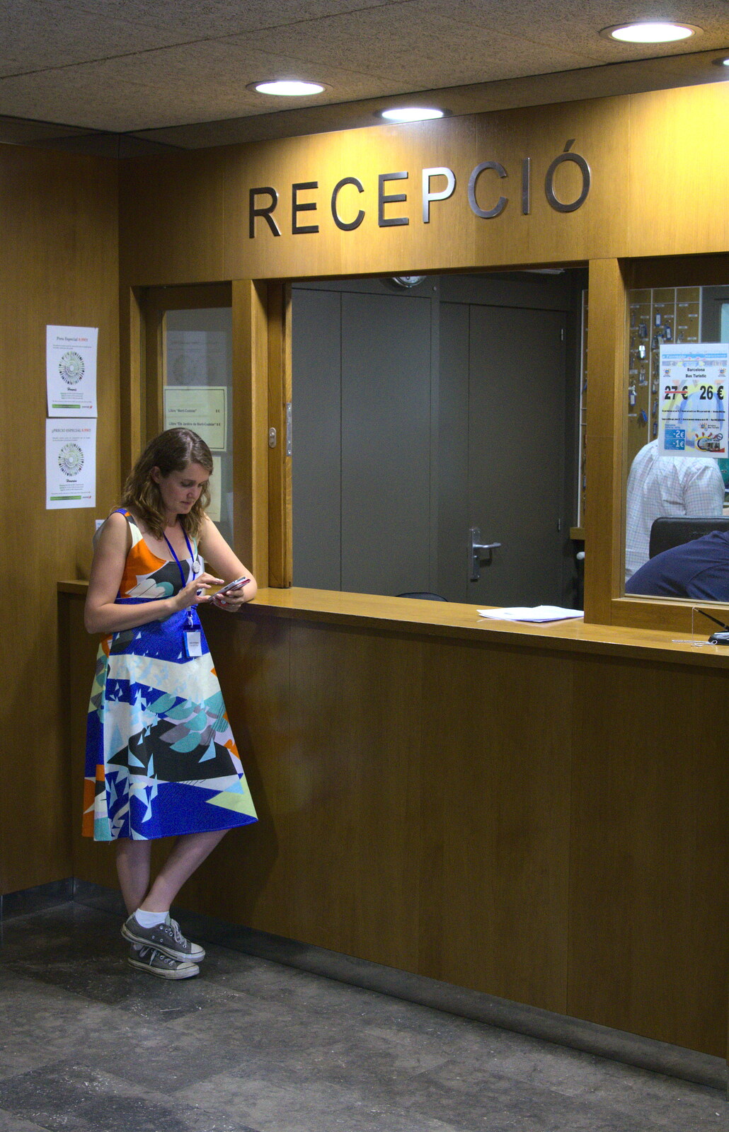 Isobel waits at reception to check out from The Open Education Challenge, Barcelona, Catalonia - 13th July 2014