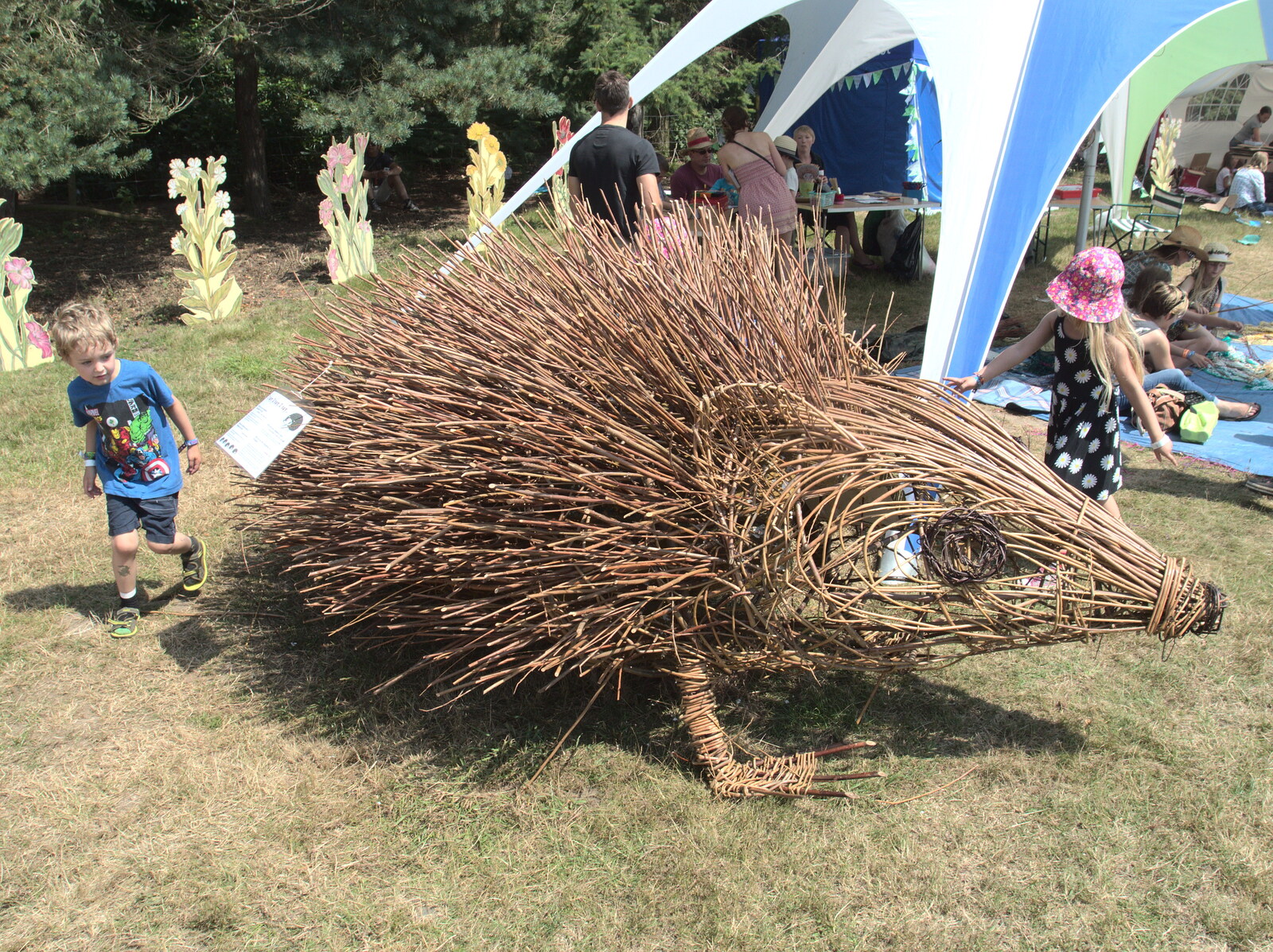 Fred inspects a large spiky hedgehog from Latitude Festival, Henham Park, Southwold, Suffolk - 17th July 2014
