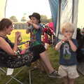 The boys eat squeezy yoghurts back at the tent, Latitude Festival, Henham Park, Southwold, Suffolk - 17th July 2014