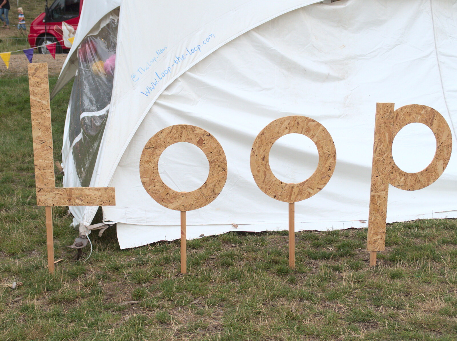 A wooden sign saying Loop from Latitude Festival, Henham Park, Southwold, Suffolk - 17th July 2014