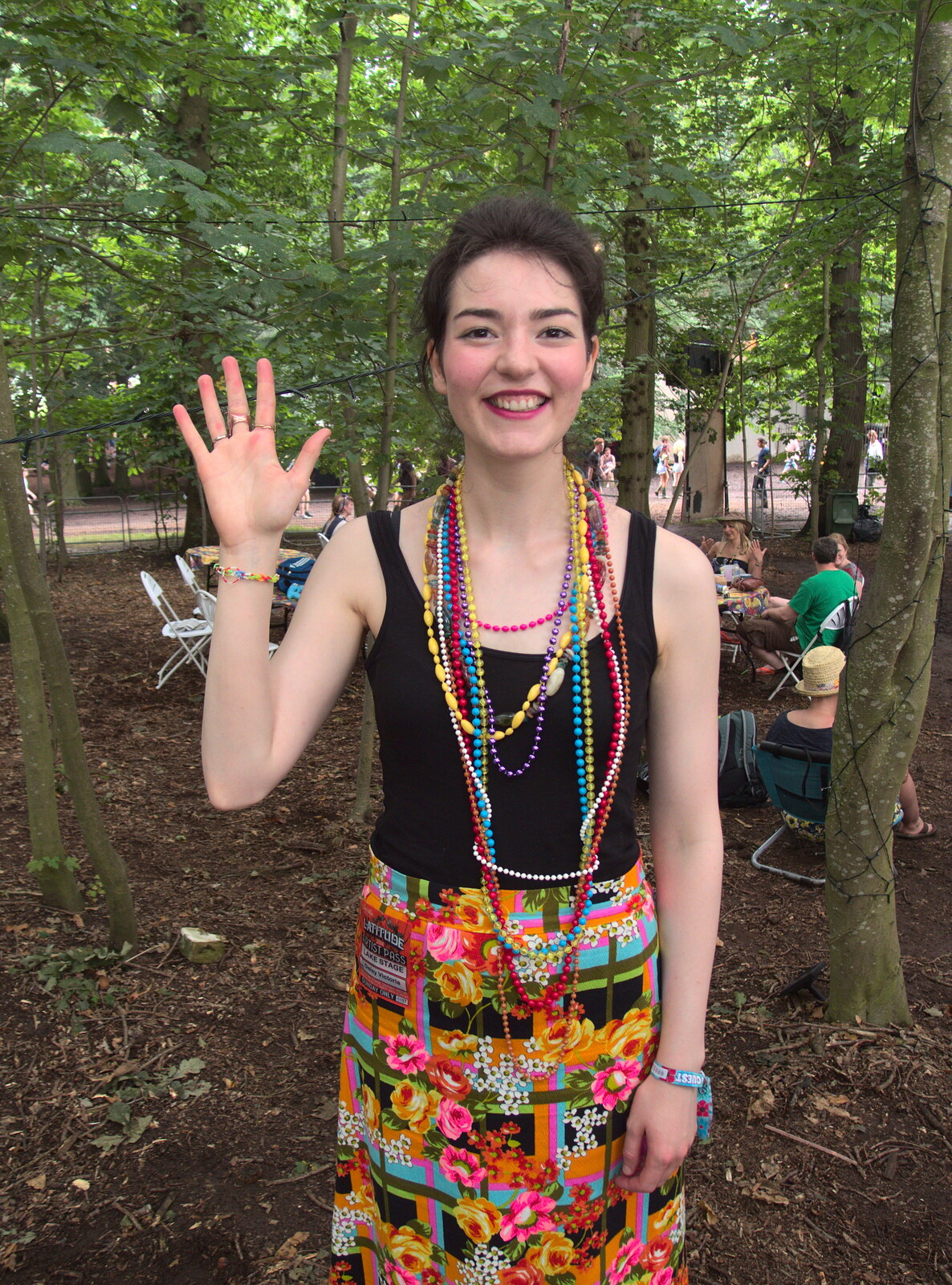 Daisy shows off the Loom Band that Fred made  from Latitude Festival, Henham Park, Southwold, Suffolk - 17th July 2014