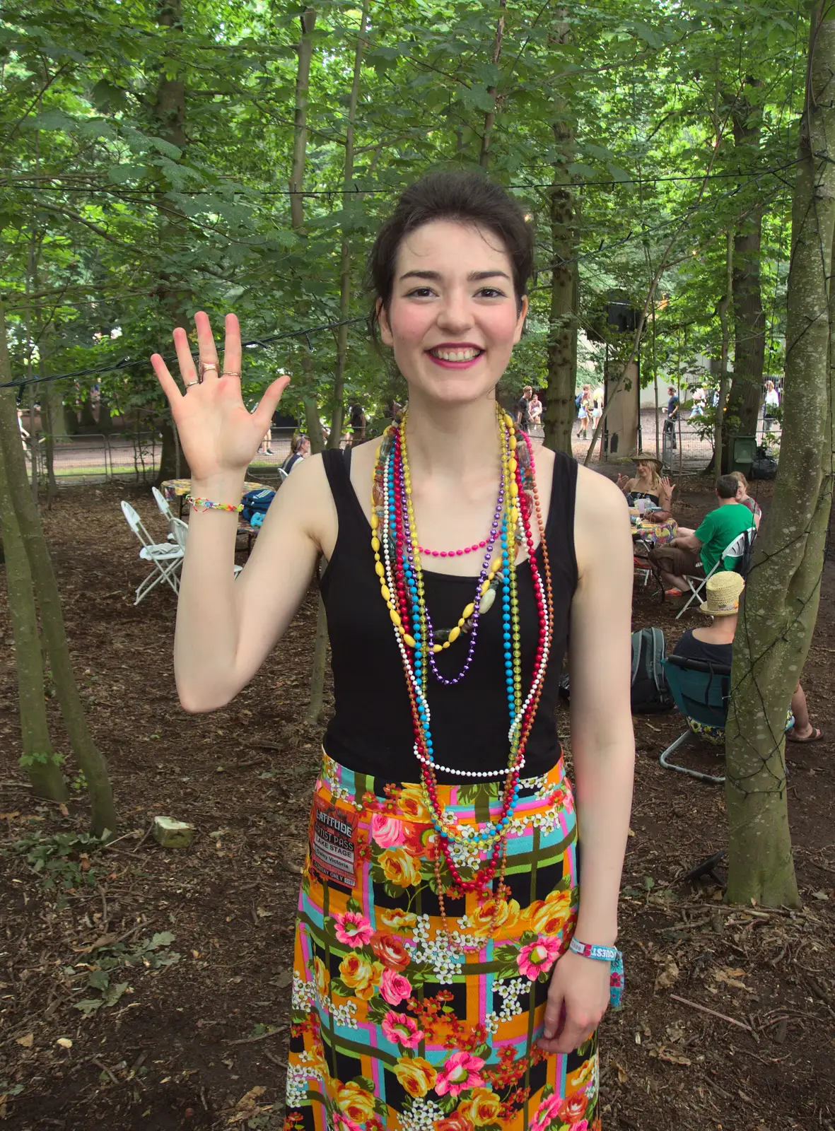 Daisy shows off the Loom Band that Fred made , from Latitude Festival, Henham Park, Southwold, Suffolk - 17th July 2014