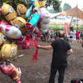 A bloke hauls balloons around, Latitude Festival, Henham Park, Southwold, Suffolk - 17th July 2014
