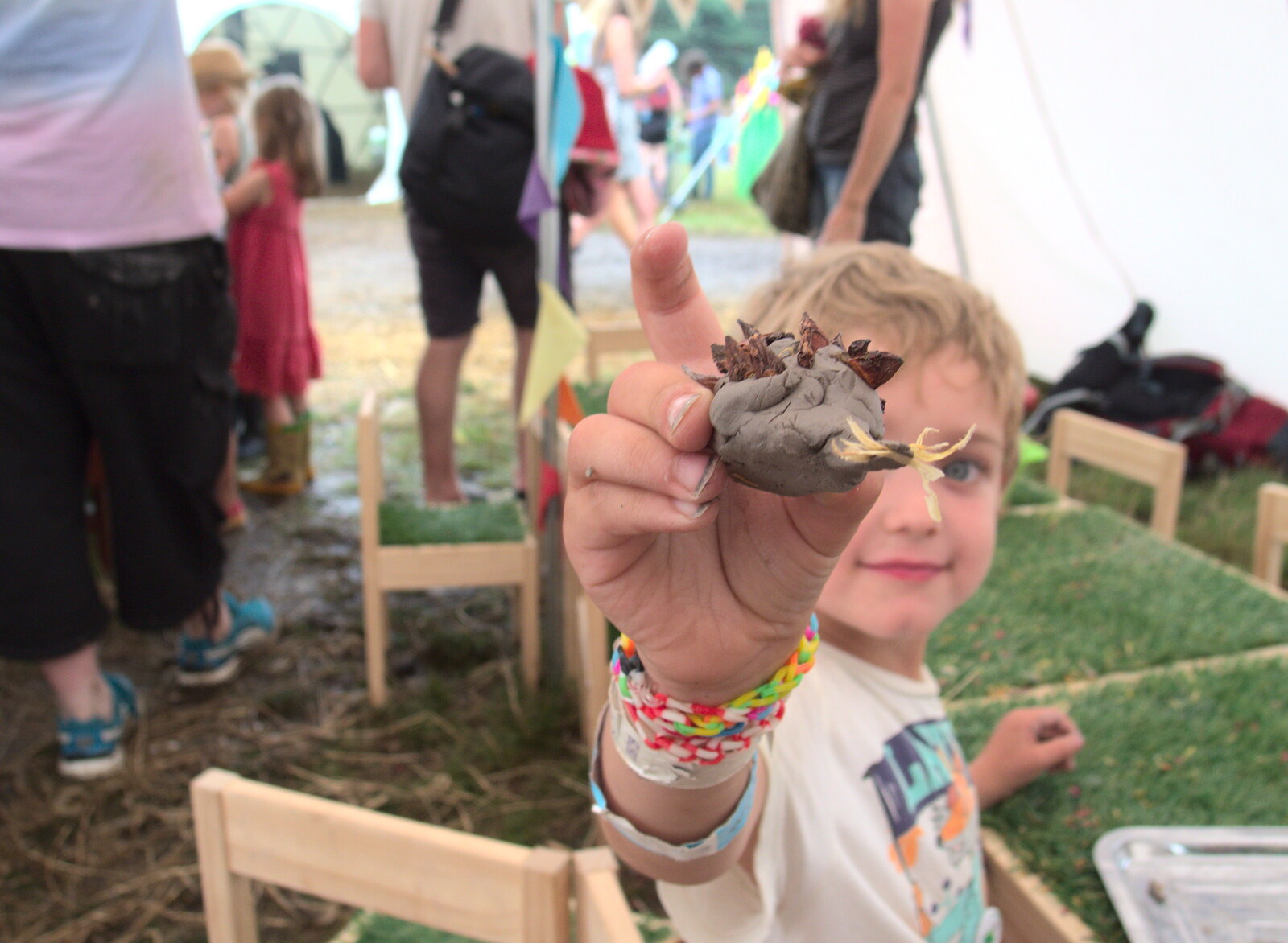 Fred shows off one of his 'making' creations from Latitude Festival, Henham Park, Southwold, Suffolk - 17th July 2014