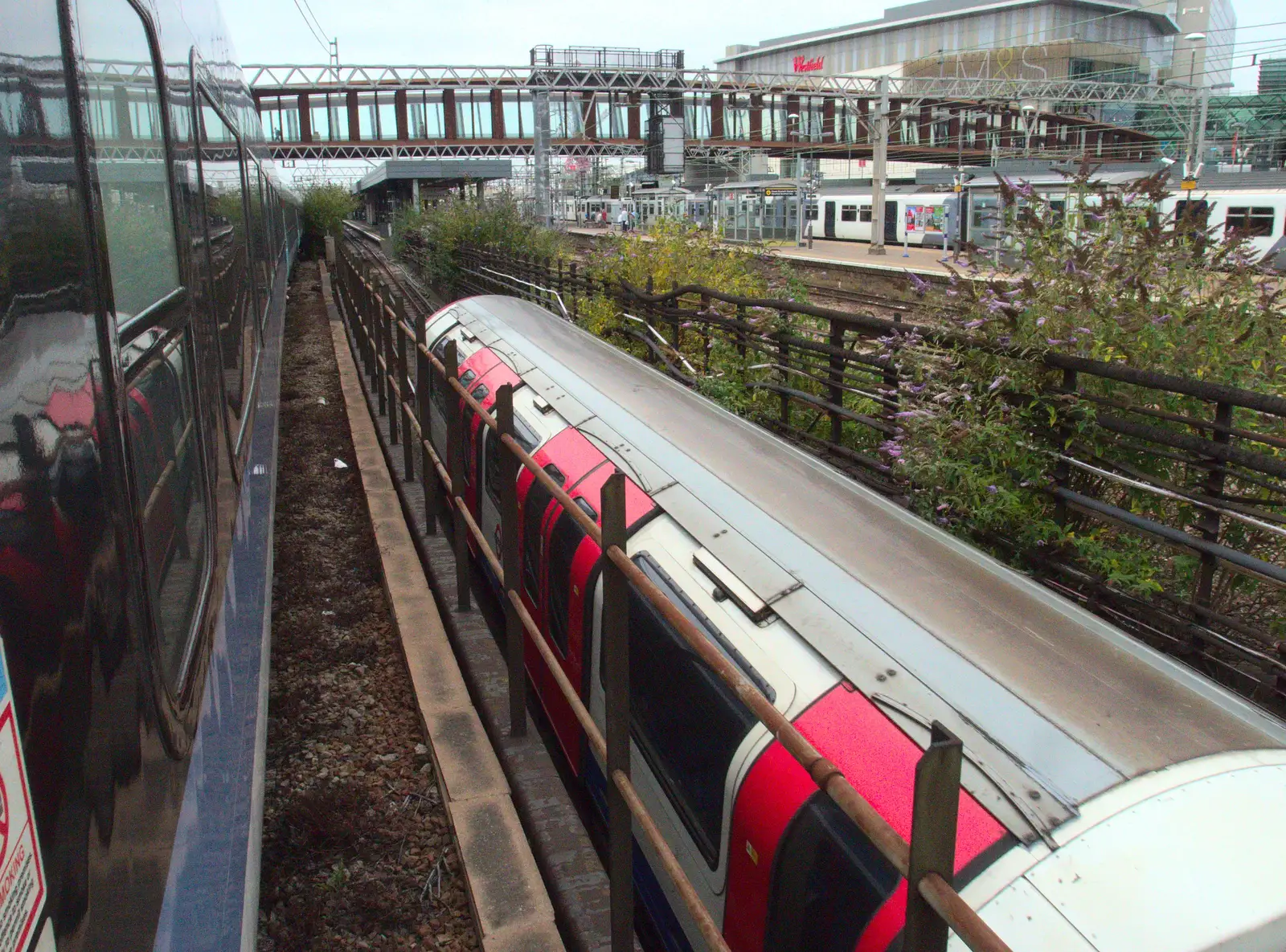 An underground trains heads, er, underground, from A Week on the Rails, Stratford and Liverpool Street, London - 23rd July