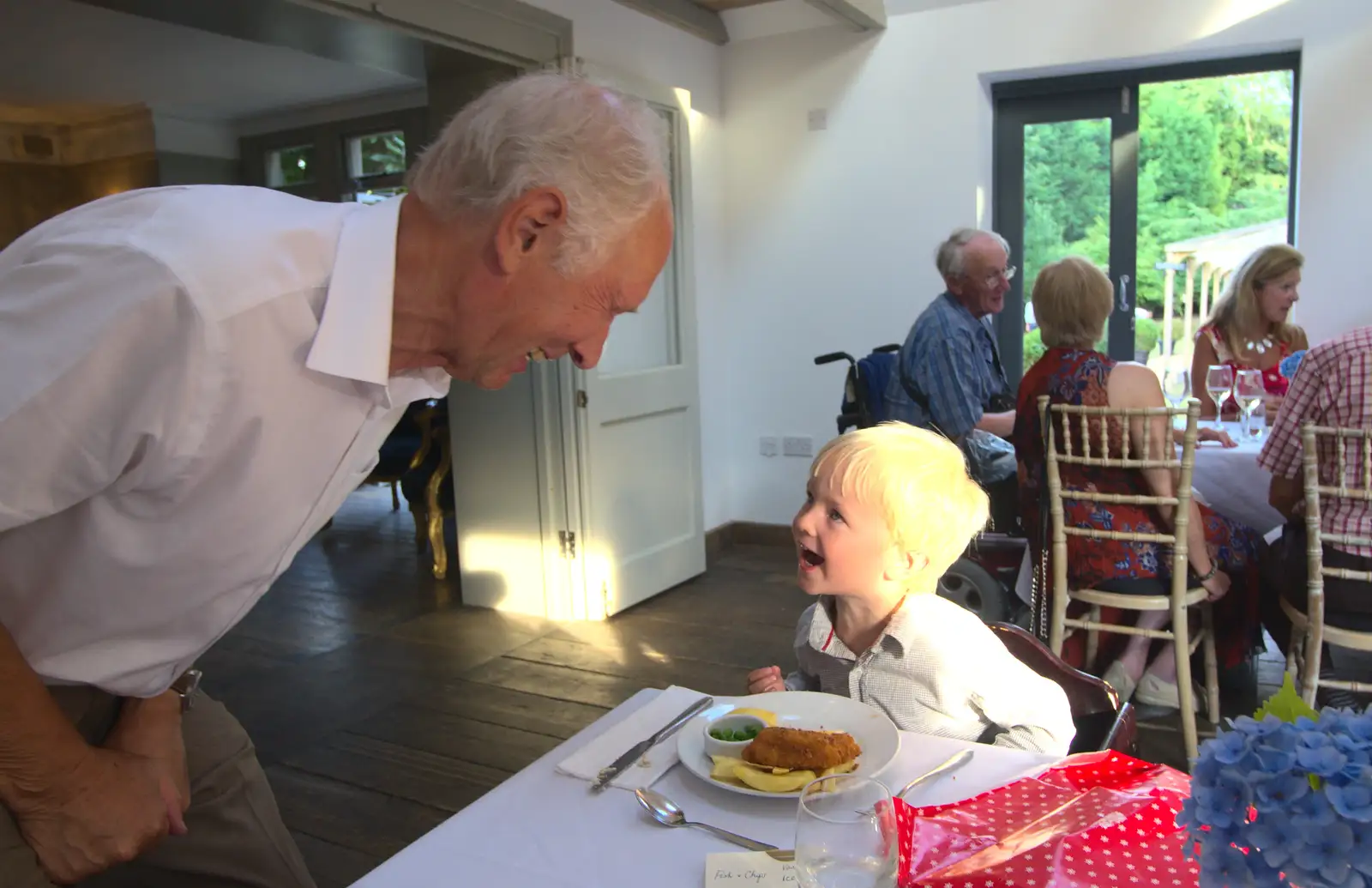 Harry has a go at roaring at Bob, from Bob and Bernice's 50th Wedding Anniversary, Hinton Admiral, Dorset - 25th July 2014