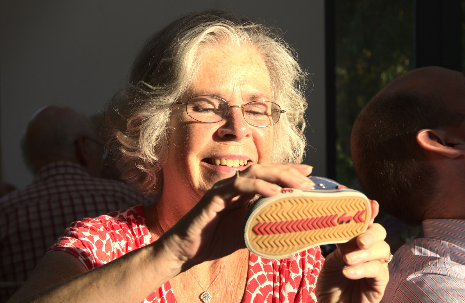 Bernice inspects a shoe from Bob and Bernice's 50th Wedding Anniversary, Hinton Admiral, Dorset - 25th July 2014