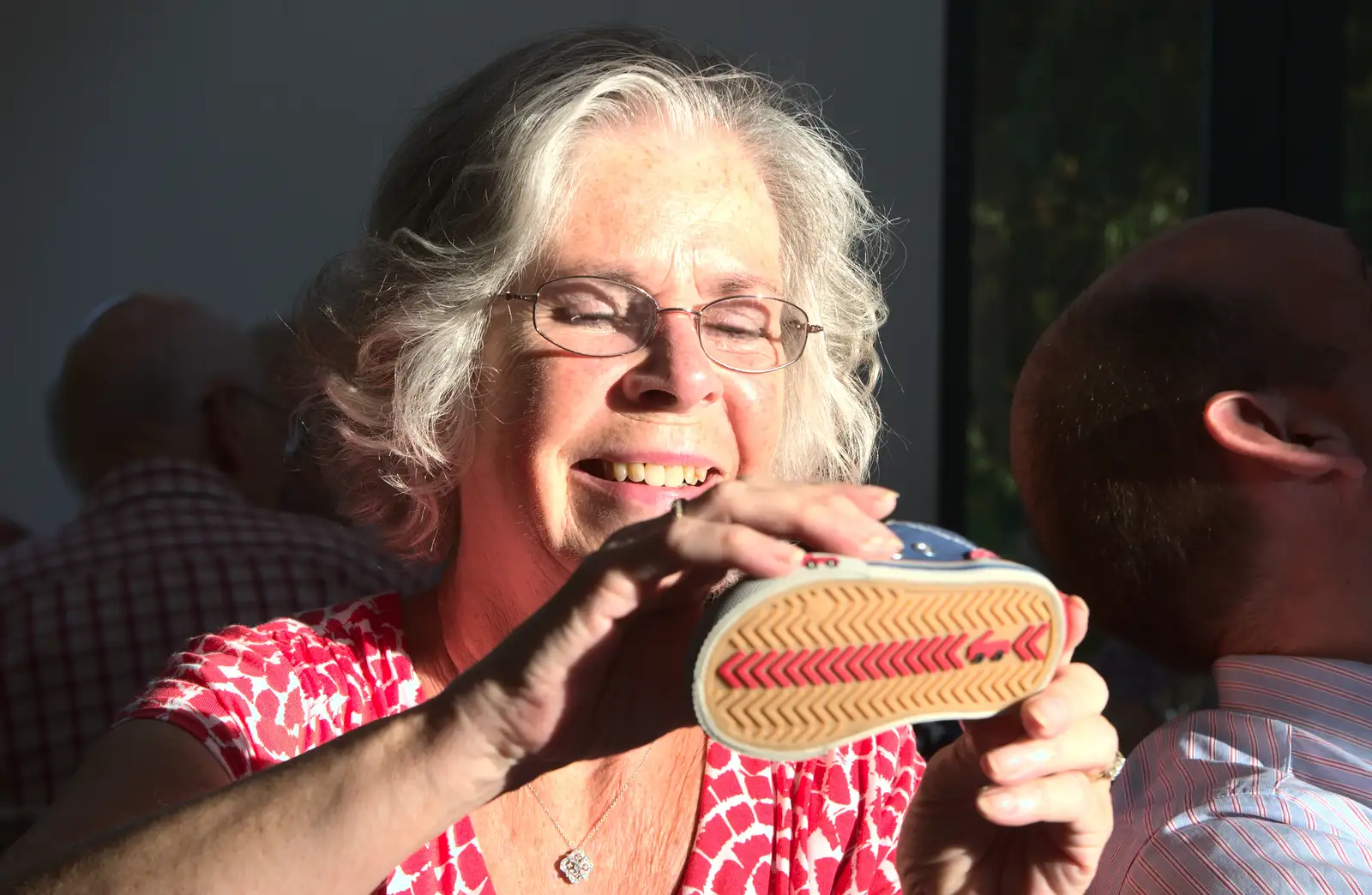 Bernice inspects a shoe, from Bob and Bernice's 50th Wedding Anniversary, Hinton Admiral, Dorset - 25th July 2014