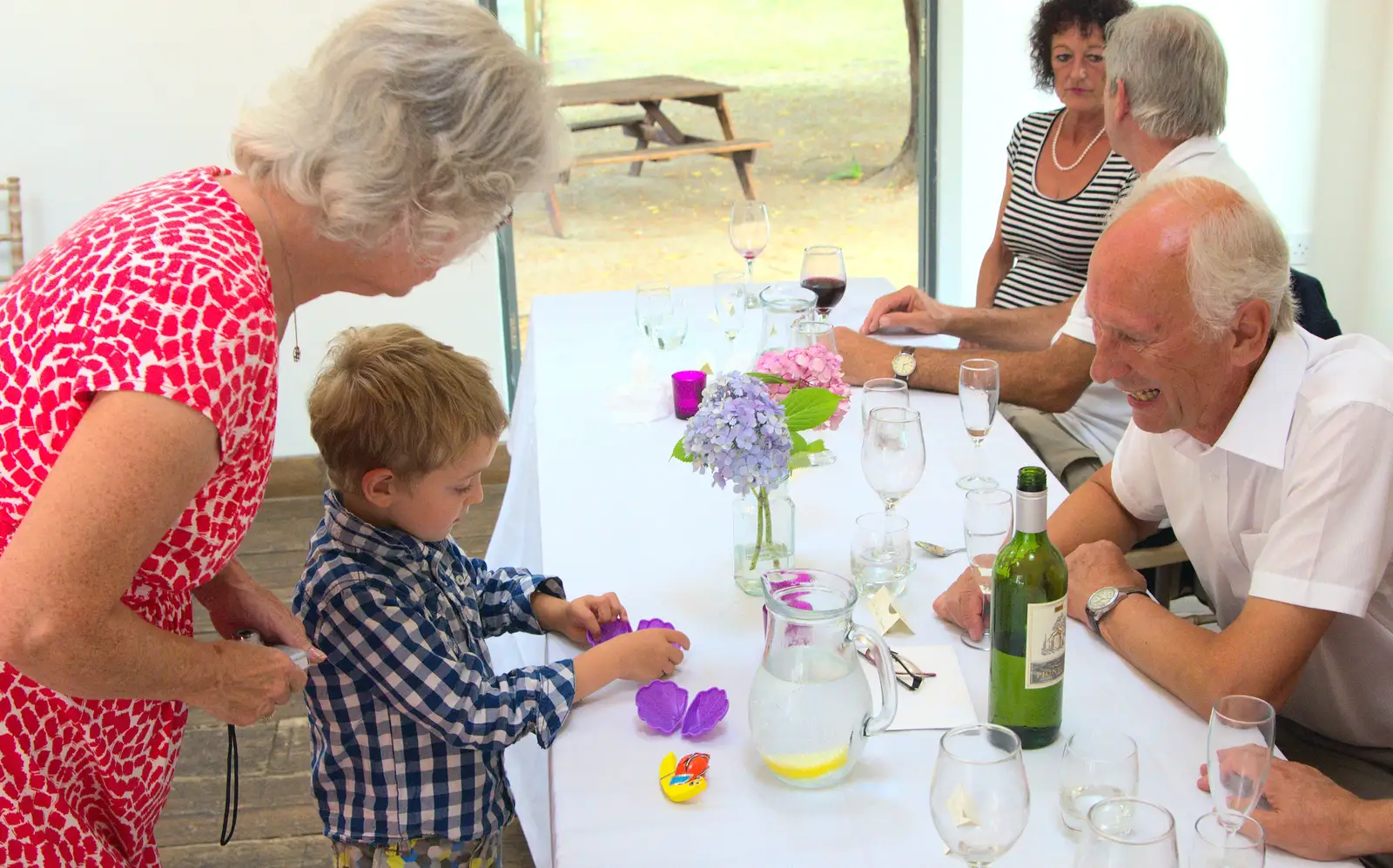 Fred makes a clam out of his magazine gift, from Bob and Bernice's 50th Wedding Anniversary, Hinton Admiral, Dorset - 25th July 2014