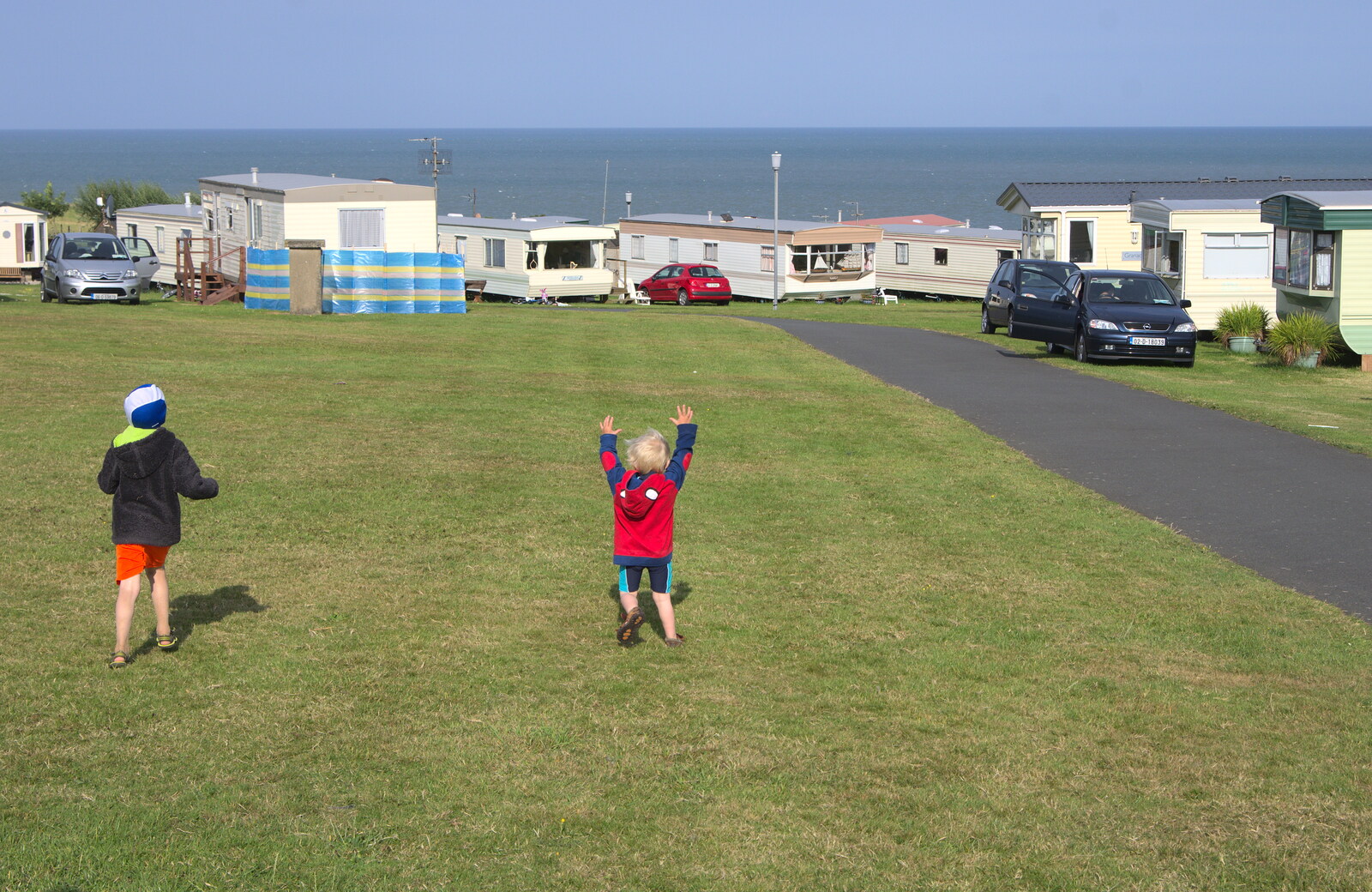 Harry roams around with his arms in the air from Camping at Silver Strand, Wicklow, County Wicklow, Ireland - 7th August 2014