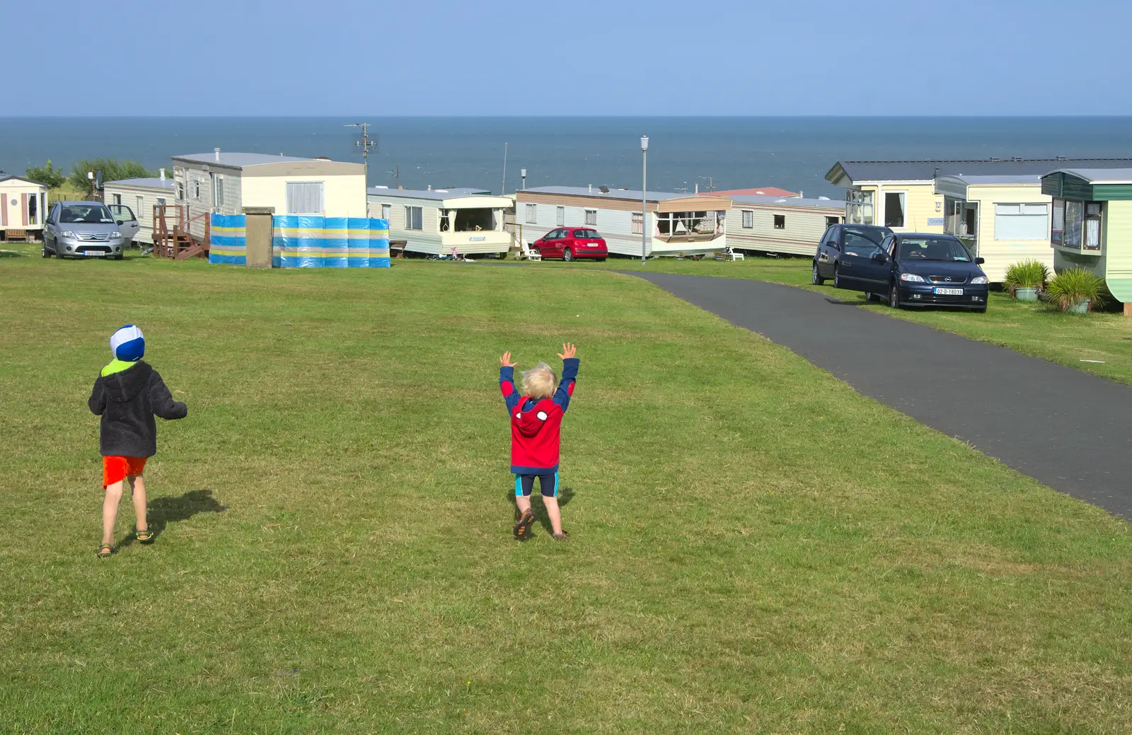 Harry roams around with his arms in the air, from Camping at Silver Strand, Wicklow, County Wicklow, Ireland - 7th August 2014