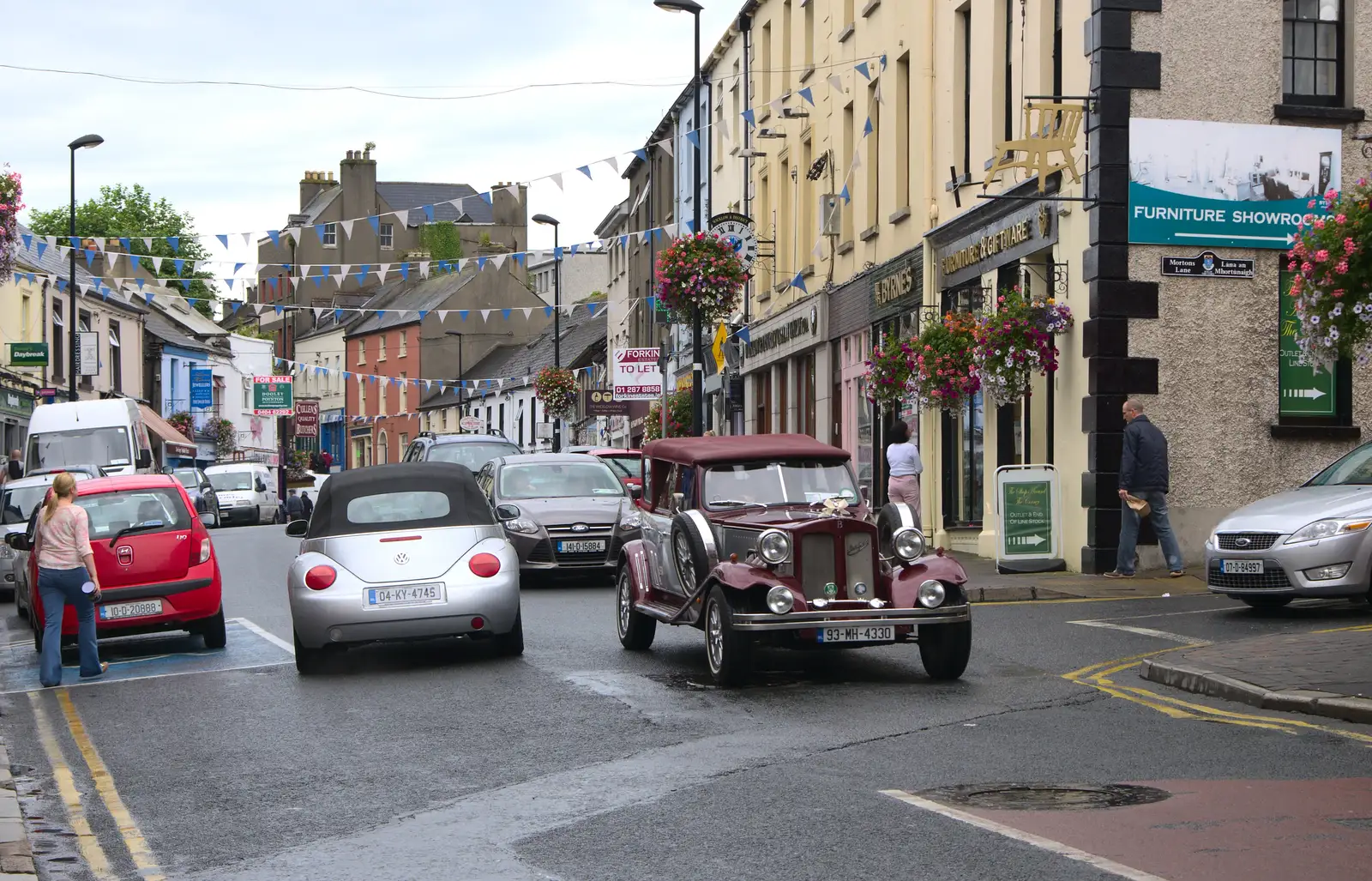 A cool old car drives through town, from Camping at Silver Strand, Wicklow, County Wicklow, Ireland - 7th August 2014