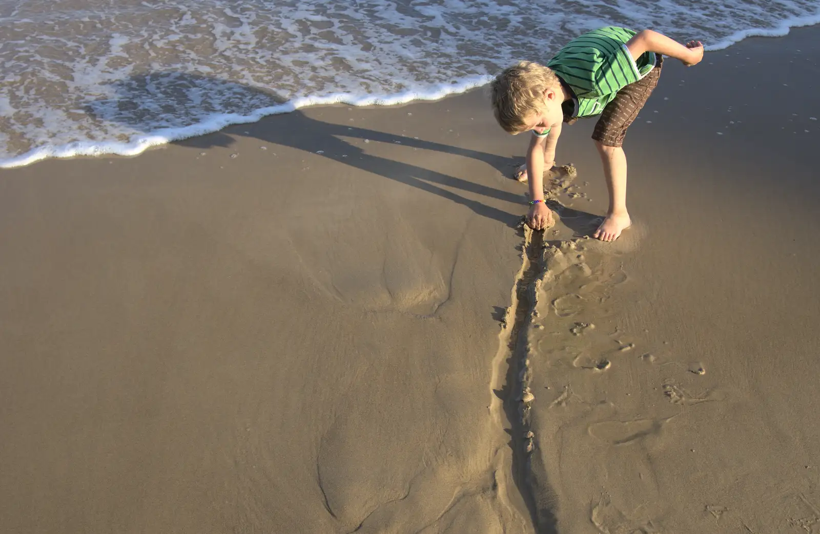 Fred digs a trench to the sea, from Camping at Silver Strand, Wicklow, County Wicklow, Ireland - 7th August 2014