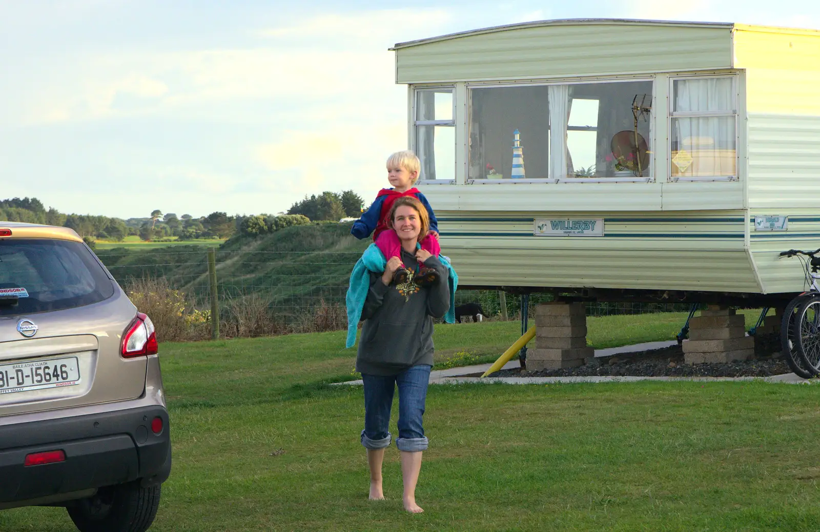 Isobel carries Harry back up from the beach, from Camping at Silver Strand, Wicklow, County Wicklow, Ireland - 7th August 2014