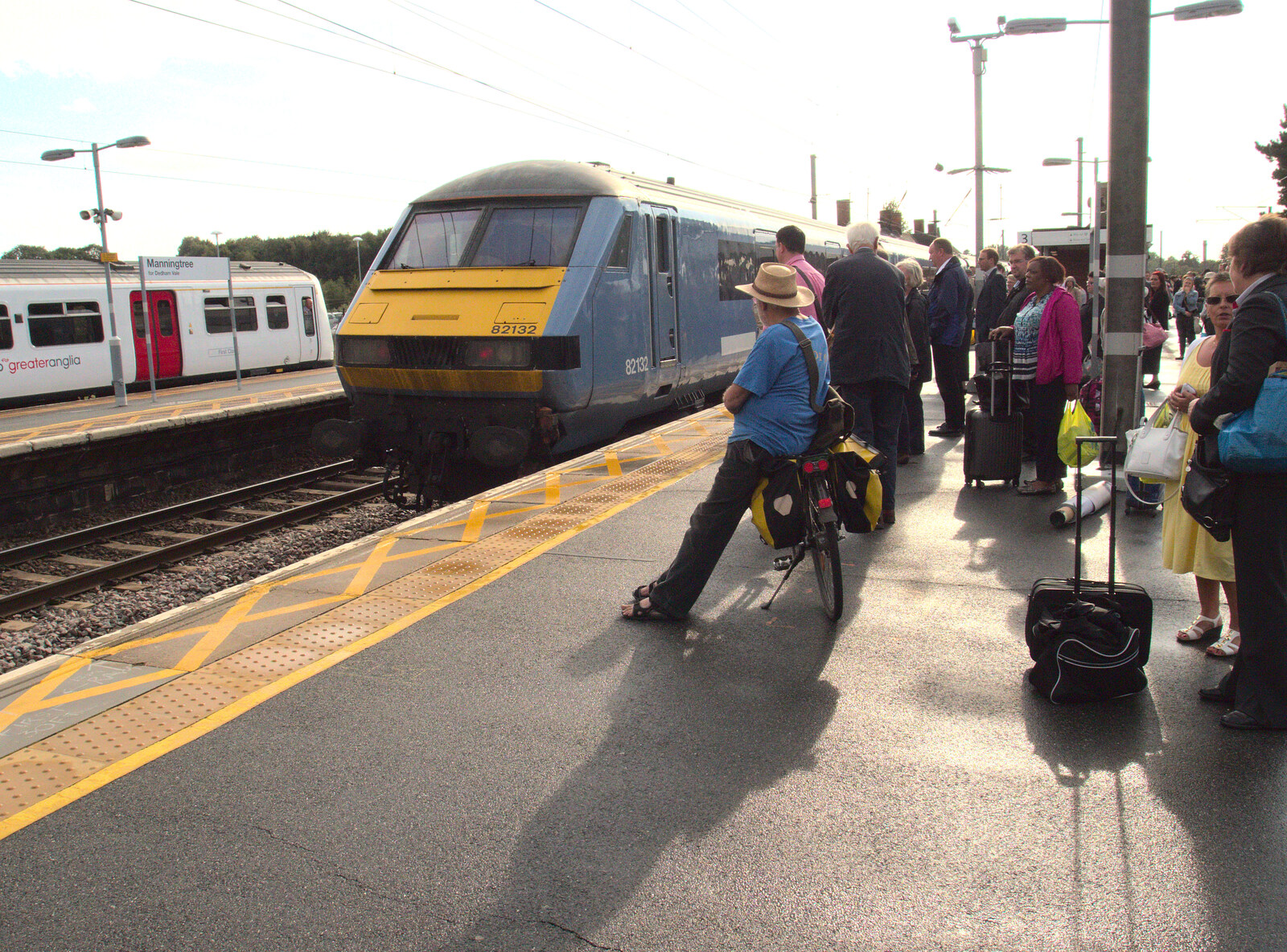 Another cyclist waits for something to happen from Train Fails, and Pizza Pub, Manningtree and Southwark - 12th August 2014