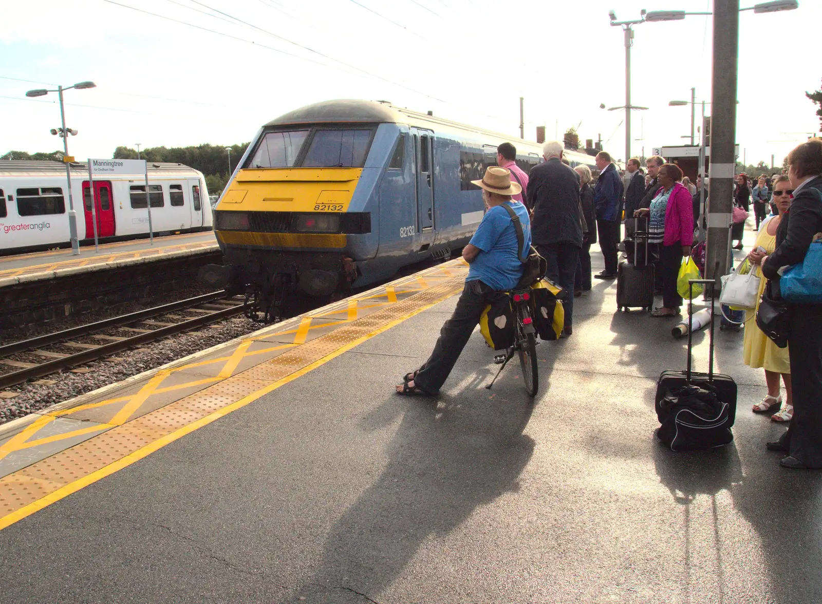 Another cyclist waits for something to happen, from Train Fails, and Pizza Pub, Manningtree and Southwark - 12th August 2014