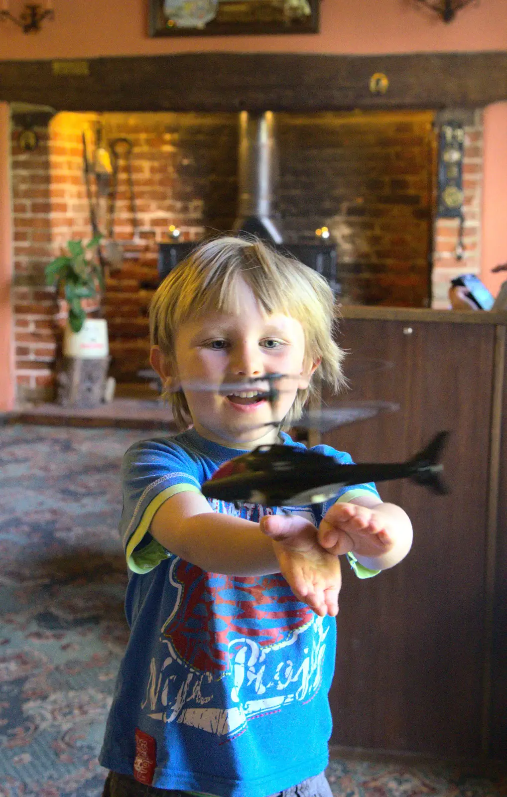 Oak tries to catch the flying helicopter, from Matthew's Birthday up The Swan Inn, Brome, Suffolk - 17th August 2014