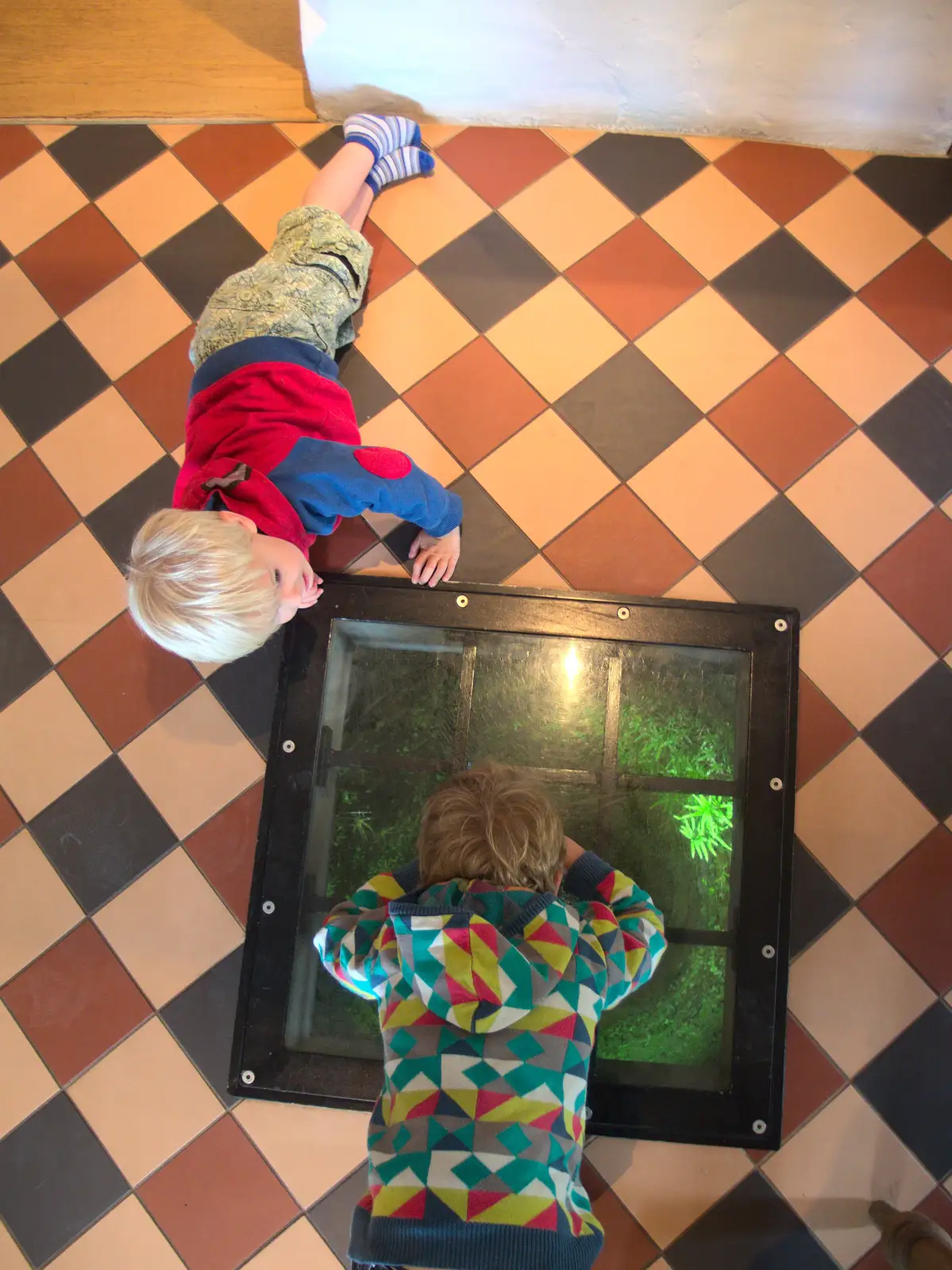 Harry and Fred are fascinated by the well, from The Oaksmere, and the Gislingham Flower Festival, Suffolk - 24th August 2014