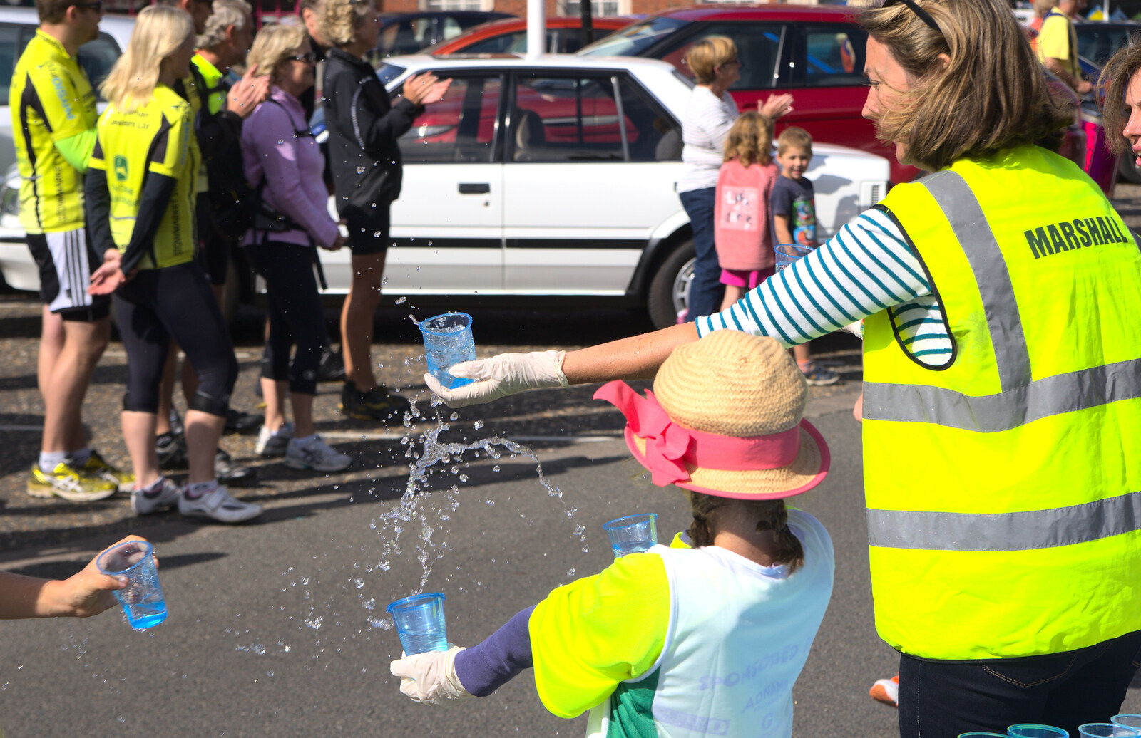 Water is handed out to the runners from The Framlingham 10k Run, Suffolk - 31st August 2014