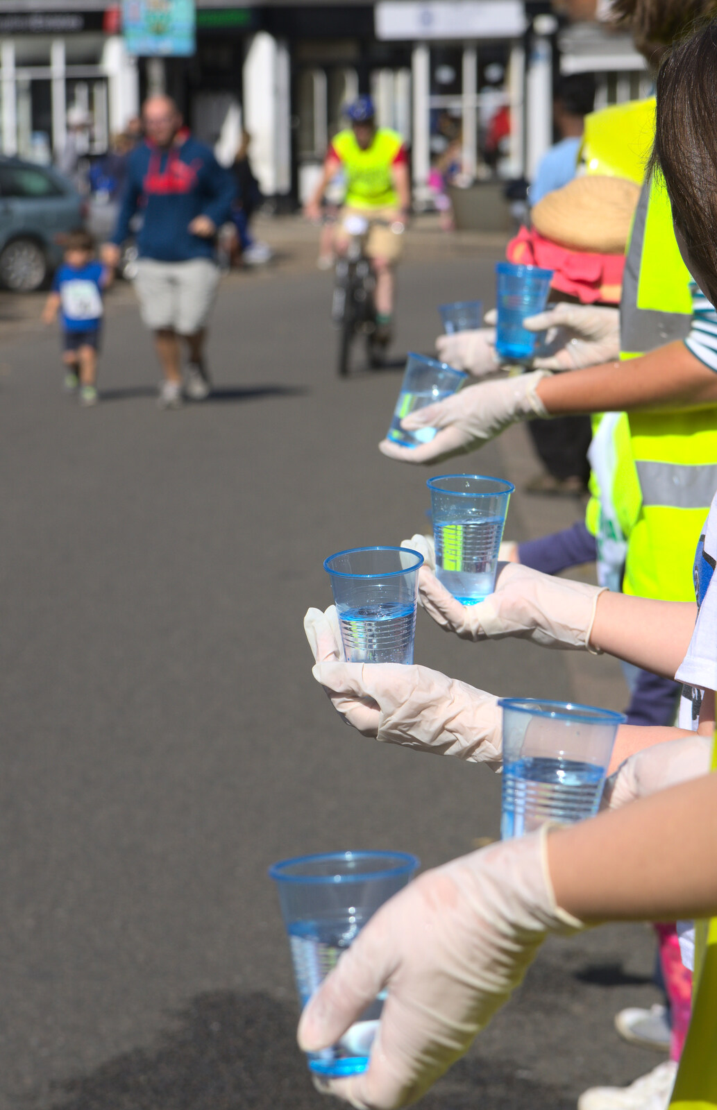 Cups of water are offered up from The Framlingham 10k Run, Suffolk - 31st August 2014