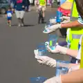 Cups of water are offered up, The Framlingham 10k Run, Suffolk - 31st August 2014