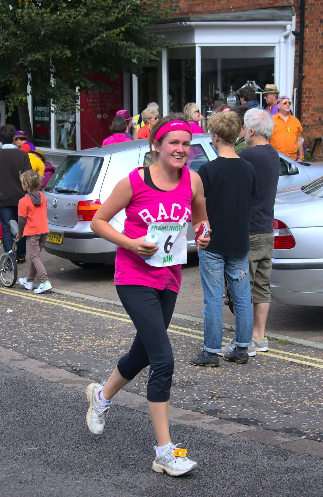 Isobel clutches Fred's cycle bottle, from The Framlingham 10k Run, Suffolk - 31st August 2014