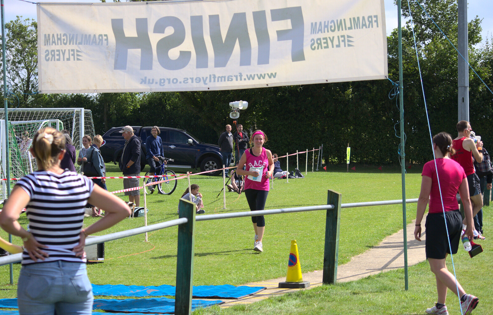 Isobel comes in to the finish line from The Framlingham 10k Run, Suffolk - 31st August 2014