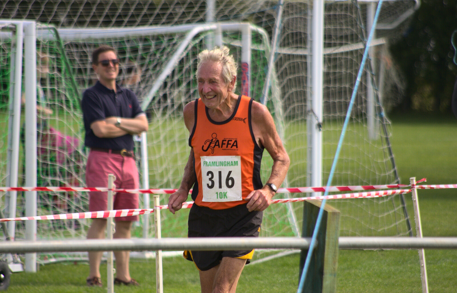 One of the oldest runners crosses the line from The Framlingham 10k Run, Suffolk - 31st August 2014