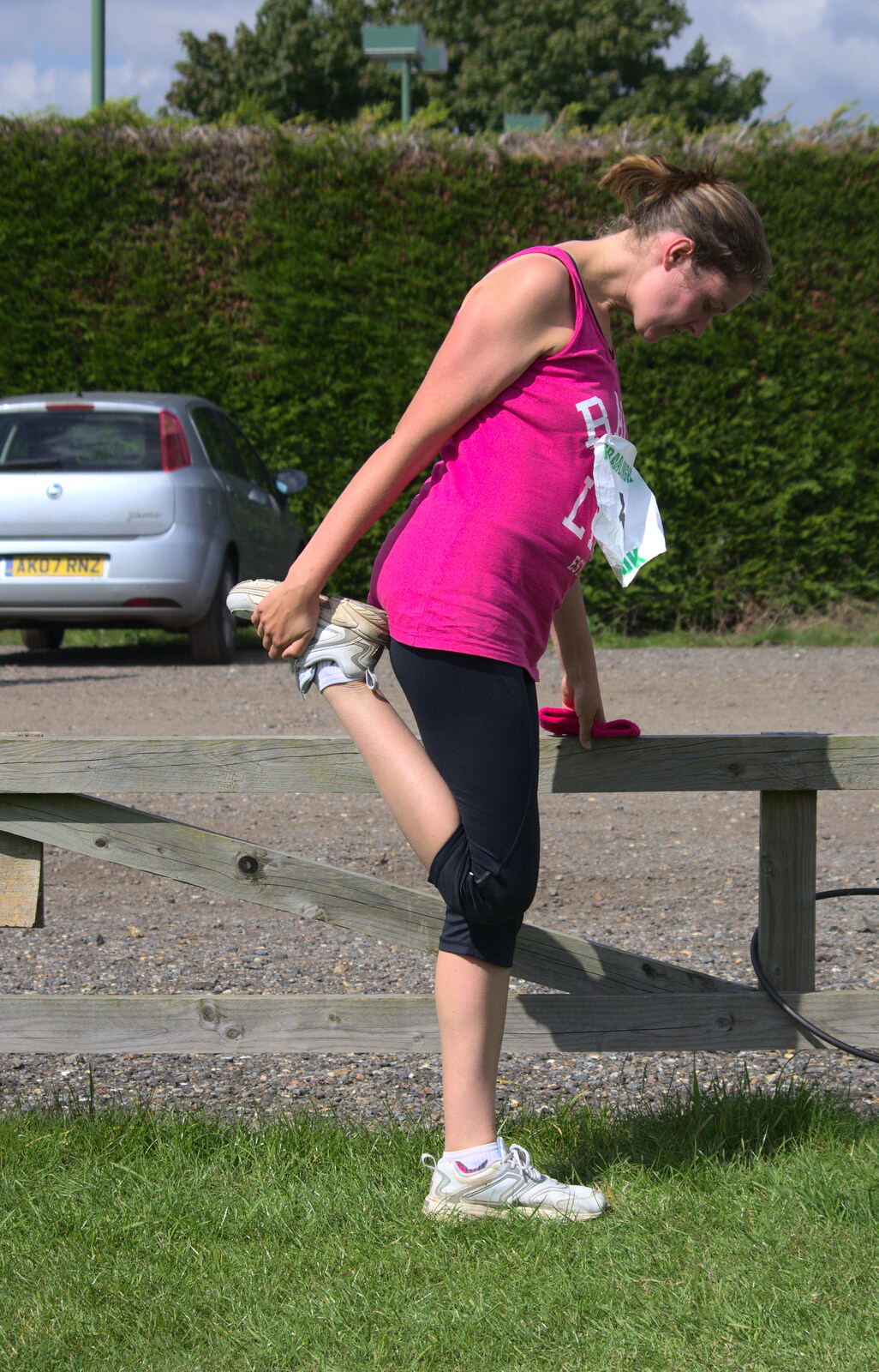 Isobel does some stretching from The Framlingham 10k Run, Suffolk - 31st August 2014