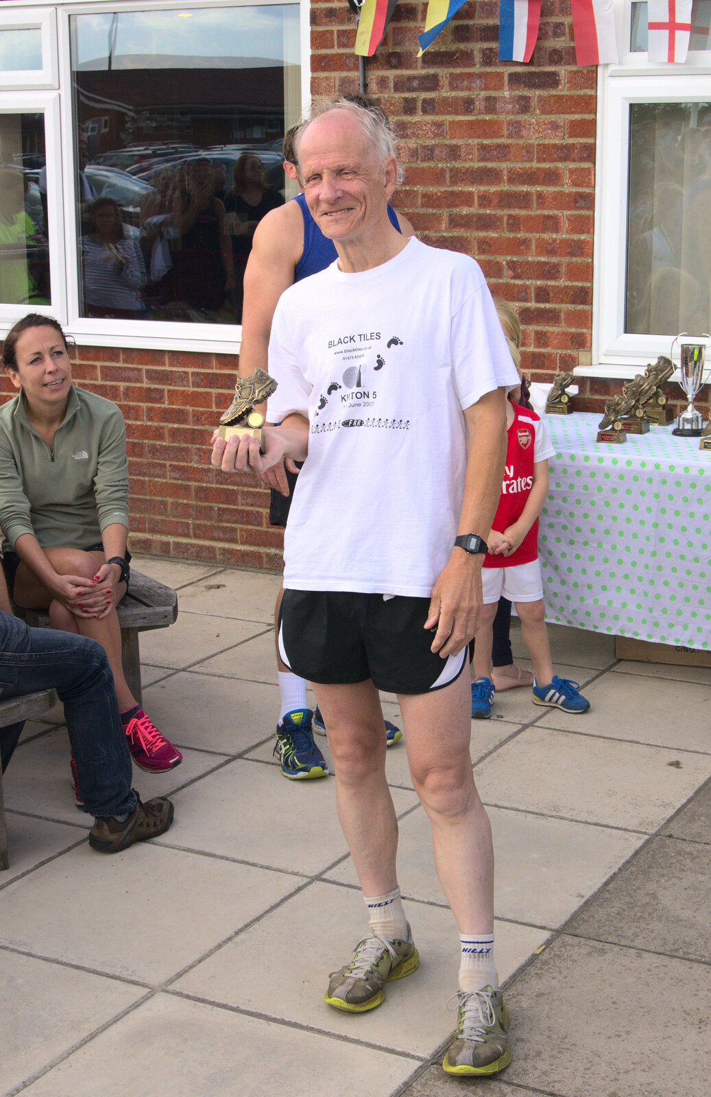 Some dude wins a prize from The Framlingham 10k Run, Suffolk - 31st August 2014